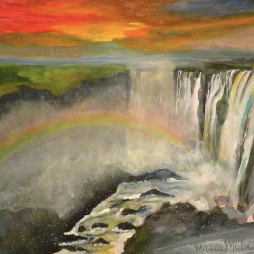Zambia the smoke that thunders by maria milazzo. Sky colors of orange and yellow, waterfall and rocks. Additonal colors of grean, light blue, grey, rainbow in the waterfall.
